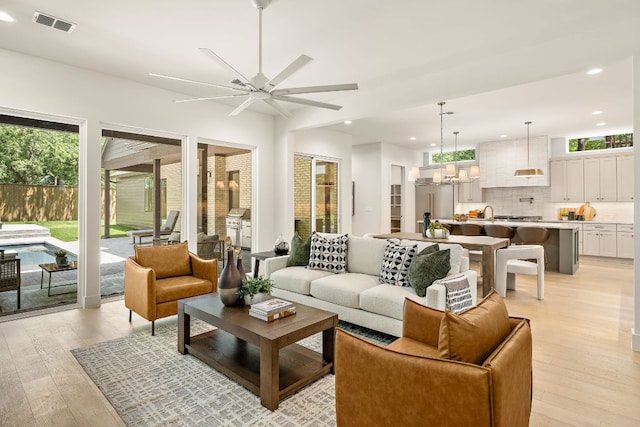 5615 Shoalwood Ave, Austin, TX 78756 - living area featuring light wood-type flooring, recessed lighting, and a ceiling fan