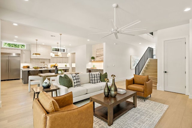 5615 Shoalwood Ave, Austin, TX 78756 - living area featuring light wood-style floors, ceiling fan, recessed lighting, stairs, and baseboards