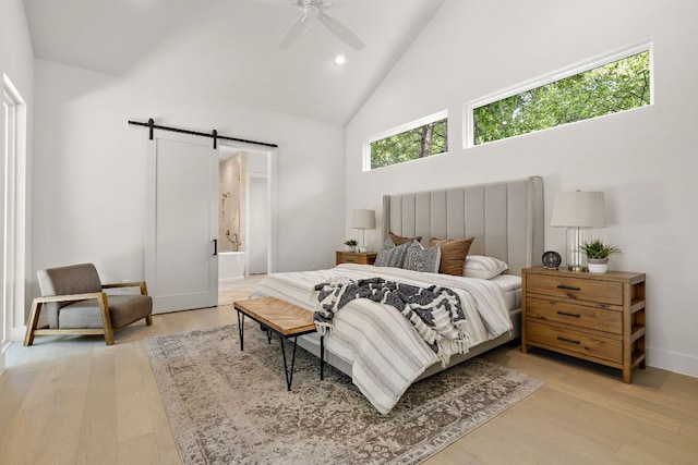 5615 Shoalwood Ave, Austin, TX 78756 - bedroom with a barn door, high vaulted ceiling, light wood-type flooring, recessed lighting, and baseboards