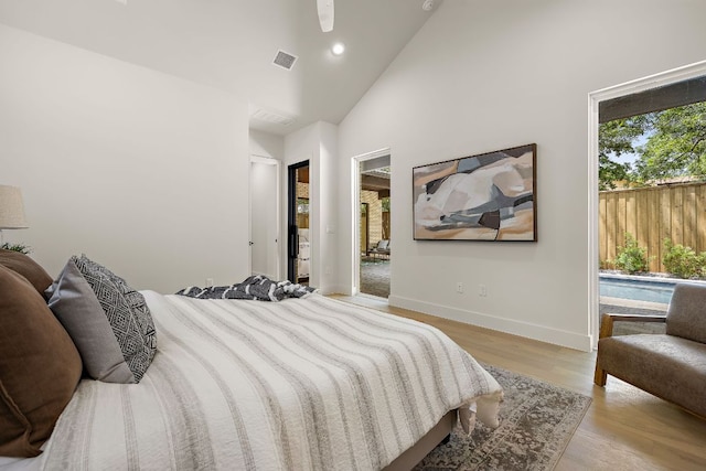5615 Shoalwood Ave, Austin, TX 78756 - bedroom with baseboards, recessed lighting, wood finished floors, and high vaulted ceiling