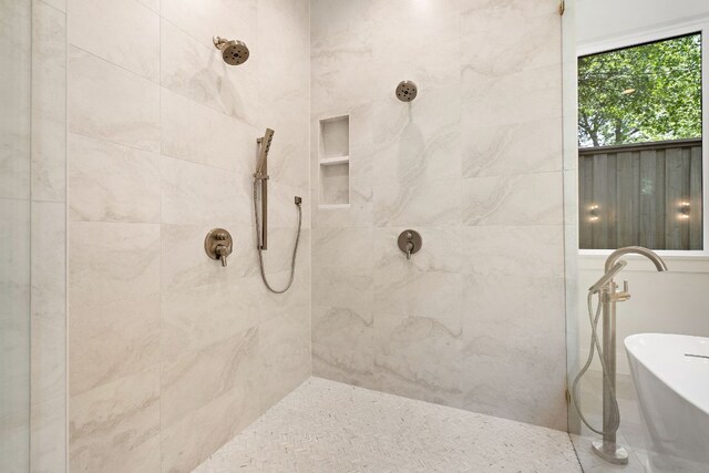 5615 Shoalwood Ave, Austin, TX 78756 - bathroom with tiled shower and a soaking tub