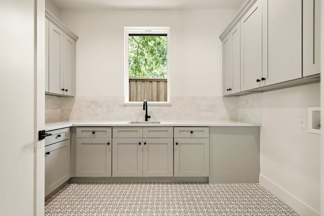 5615 Shoalwood Ave, Austin, TX 78756 - washroom with cabinet space and washer hookup