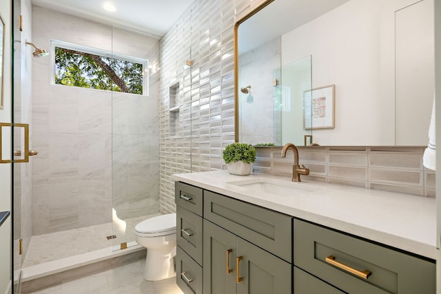 5615 Shoalwood Ave, Austin, TX 78756 - full bath with toilet, vanity, a tile shower, and tasteful backsplash