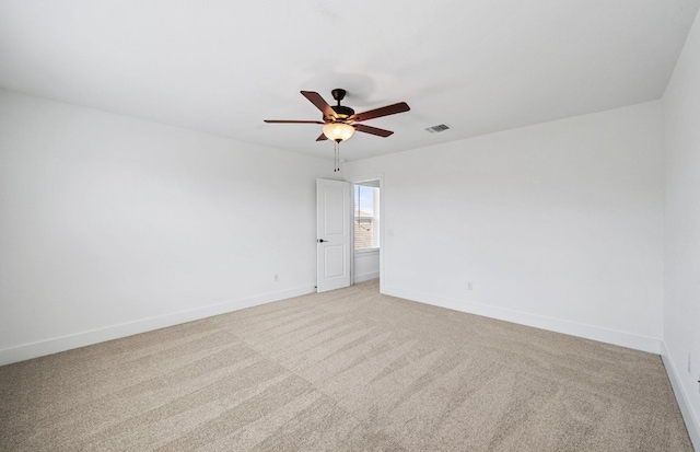 577 Tailwind Dr, Kyle, TX 78640 - unfurnished room featuring a ceiling fan, light colored carpet, and baseboards