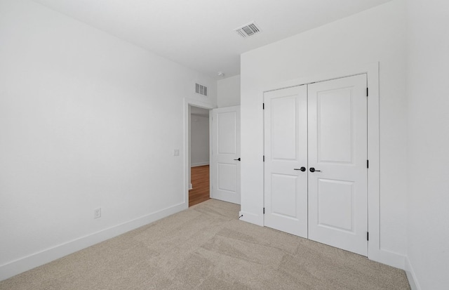 577 Tailwind Dr, Kyle, TX 78640 - unfurnished bedroom featuring carpet floors, baseboards, and a closet