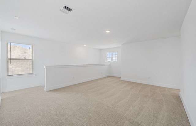 577 Tailwind Dr, Kyle, TX 78640 - unfurnished room with light colored carpet, baseboards, and recessed lighting