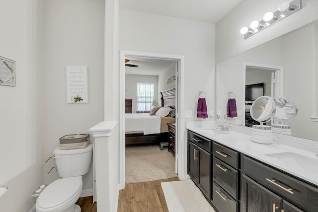 14411 Frankel Loop Unit 32B, Pflugerville, TX 78660 - ensuite bathroom with double vanity and wood finished floors