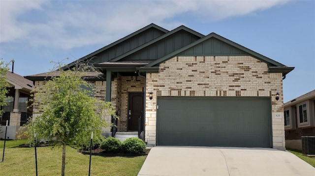 520 Elm Green St, Hutto, TX 78634 - craftsman inspired home featuring board and batten siding, concrete driveway, an attached garage, and a front lawn