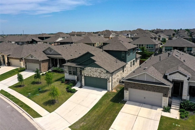 520 Elm Green St, Hutto, TX 78634 - view of front of home with a residential view, driveway, a shingled roof, and board and batten siding
