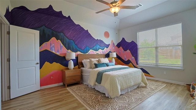 520 Elm Green St, Hutto, TX 78634 - bedroom with light wood-type flooring, baseboards, ceiling fan, and lofted ceiling