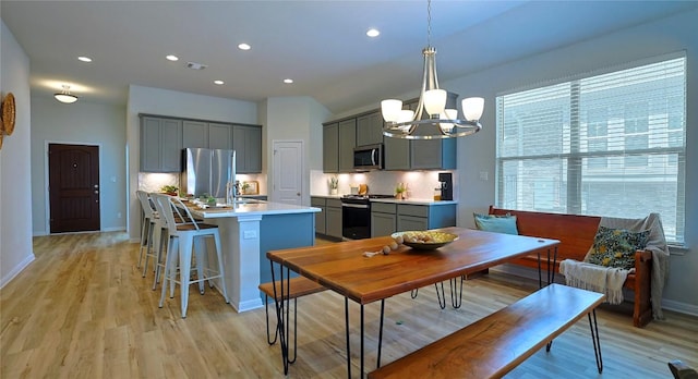 520 Elm Green St, Hutto, TX 78634 - dining area featuring light wood-type flooring, a chandelier, recessed lighting, and baseboards