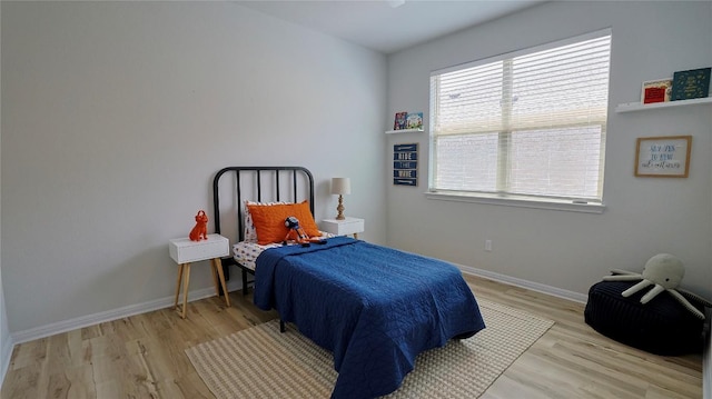 520 Elm Green St, Hutto, TX 78634 - bedroom featuring wood finished floors and baseboards