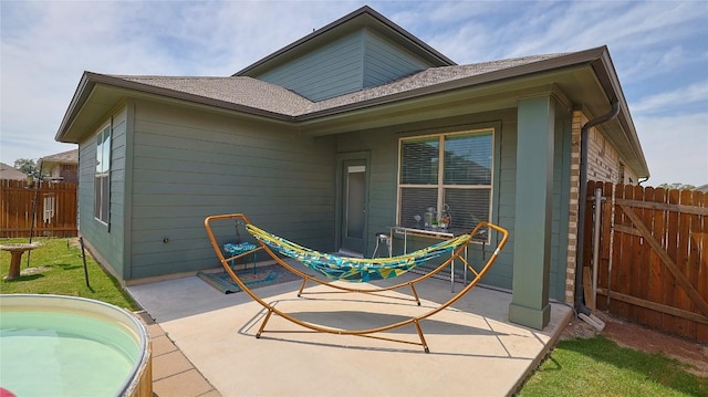 520 Elm Green St, Hutto, TX 78634 - rear view of property with a patio area and a shingled roof