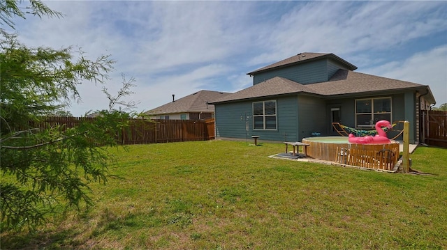 520 Elm Green St, Hutto, TX 78634 - rear view of house with roof with shingles