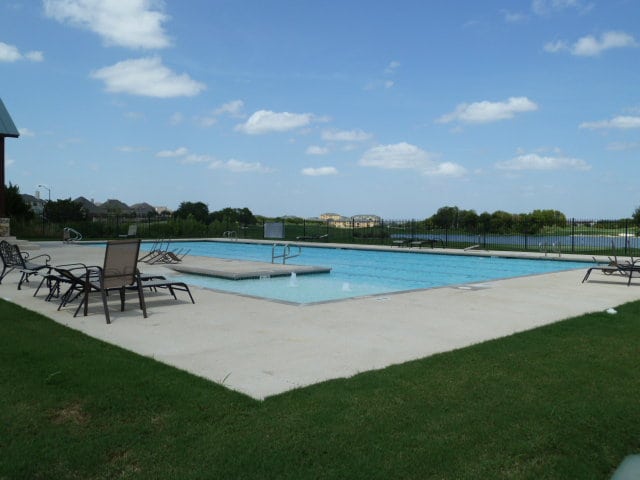 520 Elm Green St, Hutto, TX 78634 - community pool with a patio area