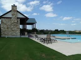520 Elm Green St, Hutto, TX 78634 - community pool with a patio area and a yard