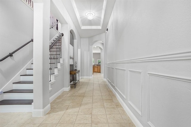 114 Mcbride Ln, Cedar Park, TX 78613 - corridor featuring arched walkways, stairway, a decorative wall, and light tile patterned flooring