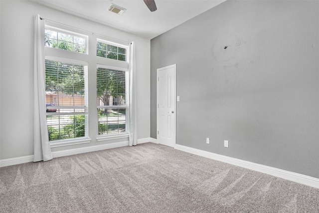 114 Mcbride Ln, Cedar Park, TX 78613 - empty room with healthy amount of natural light, a ceiling fan, carpet flooring, and baseboards