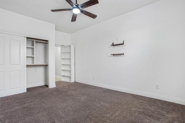 114 Mcbride Ln, Cedar Park, TX 78613 - unfurnished bedroom featuring dark colored carpet, a closet, and a ceiling fan