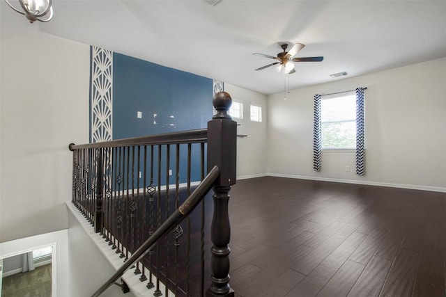 114 Mcbride Ln, Cedar Park, TX 78613 - staircase featuring wood finished floors, a ceiling fan, and baseboards