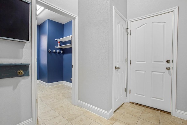 114 Mcbride Ln, Cedar Park, TX 78613 - corridor with light tile patterned floors and baseboards