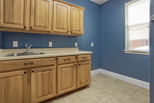 114 Mcbride Ln, Cedar Park, TX 78613 - kitchen featuring a sink, light countertops, baseboards, and light tile patterned floors