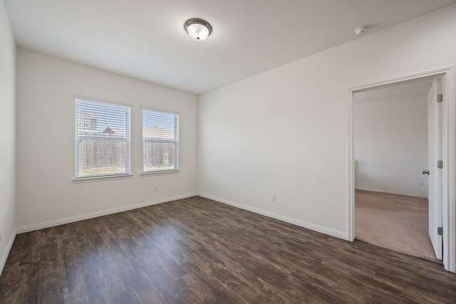13804 Mark Christopher Way, Manor, TX 78653 - spare room with dark wood-type flooring, baseboards, and a smoke detector
