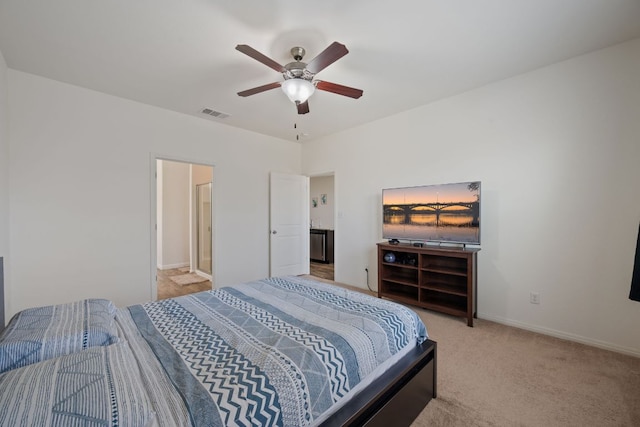 13804 Mark Christopher Way, Manor, TX 78653 - carpeted bedroom featuring baseboards, ceiling fan, and ensuite bathroom