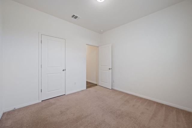 13804 Mark Christopher Way, Manor, TX 78653 - unfurnished bedroom featuring light carpet and baseboards