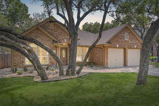 6411 Abilene Trl, Austin, TX 78749 - view of front of house featuring brick siding, a garage, concrete driveway, and roof with shingles