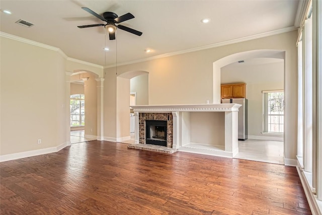 6411 Abilene Trl, Austin, TX 78749 - unfurnished living room featuring a ceiling fan, plenty of natural light, light wood-style flooring, crown molding, and recessed lighting