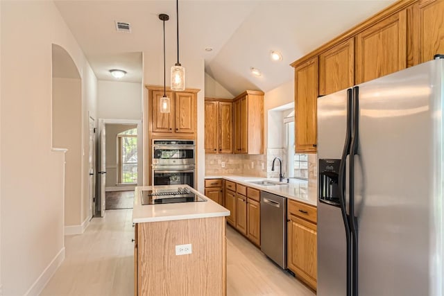 6411 Abilene Trl, Austin, TX 78749 - kitchen featuring stainless steel appliances, a sink, a center island, light countertops, and decorative backsplash