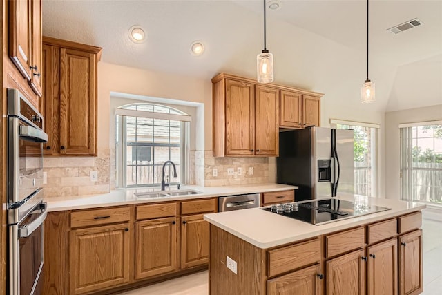 6411 Abilene Trl, Austin, TX 78749 - kitchen featuring stainless steel appliances, decorative backsplash, pendant lighting, light countertops, and lofted ceiling
