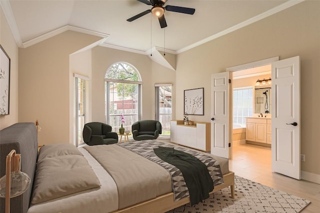 6411 Abilene Trl, Austin, TX 78749 - bedroom with crown molding, lofted ceiling, connected bathroom, light wood-type flooring, and ceiling fan