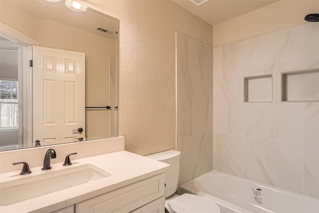 6411 Abilene Trl, Austin, TX 78749 - full bath featuring a textured wall, vanity, and  shower combination