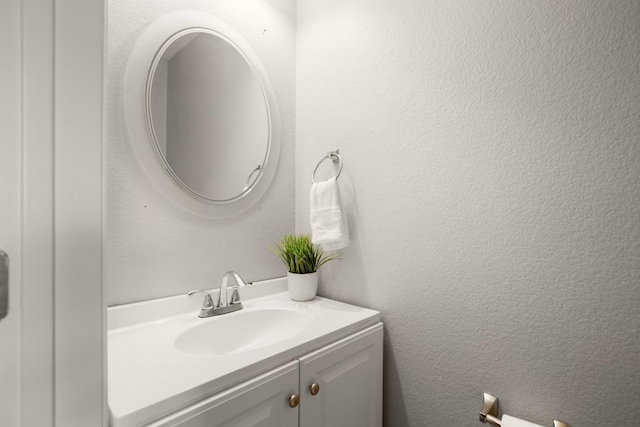 3505 Winding Shore Ln, Pflugerville, TX 78660 - bathroom featuring vanity and a textured wall