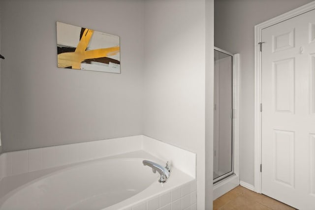 3505 Winding Shore Ln, Pflugerville, TX 78660 - full bath featuring a stall shower, a garden tub, tile patterned floors, and baseboards