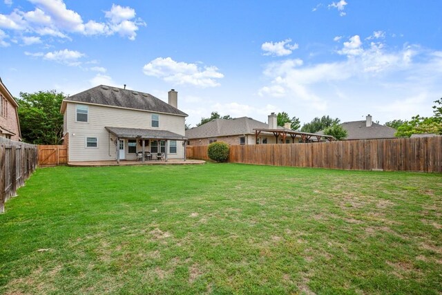 3505 Winding Shore Ln, Pflugerville, TX 78660 - rear view of property featuring a patio, a fenced backyard, and a chimney