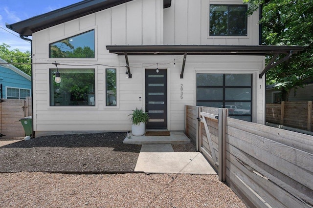 2935 Moss St Unit 1, Austin, TX 78722 - view of front of property featuring board and batten siding and an attached garage