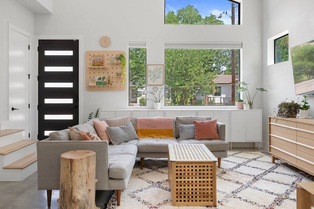 2935 Moss St Unit 1, Austin, TX 78722 - living room featuring a towering ceiling and stairs