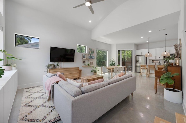 2935 Moss St Unit 1, Austin, TX 78722 - living area with high vaulted ceiling, ceiling fan, recessed lighting, and baseboards