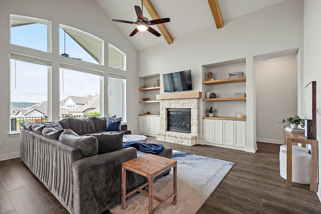 17720 Cain Clearing Pass, Austin, TX 78738 - living area featuring high vaulted ceiling, a ceiling fan, a stone fireplace, dark wood-type flooring, and beam ceiling