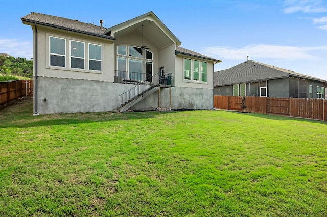 17720 Cain Clearing Pass, Austin, TX 78738 - back of property with stucco siding, a fenced backyard, and stairway