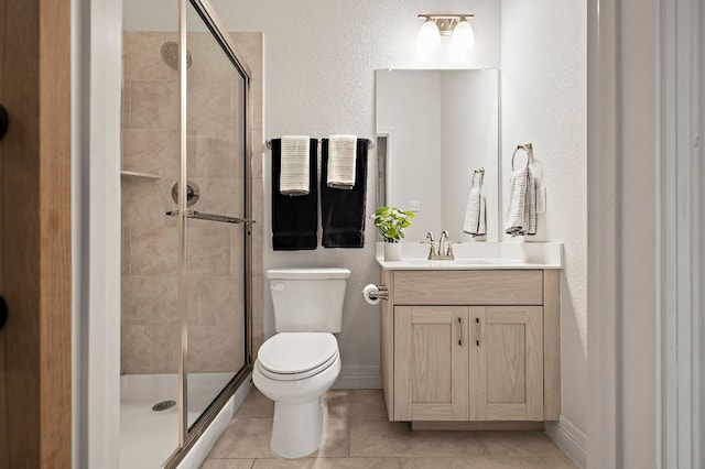 17720 Cain Clearing Pass, Austin, TX 78738 - bathroom with vanity, a stall shower, tile patterned floors, and a textured wall