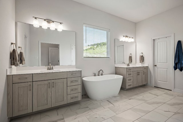 17720 Cain Clearing Pass, Austin, TX 78738 - full bathroom featuring marble look tile flooring, two vanities, and a freestanding bath