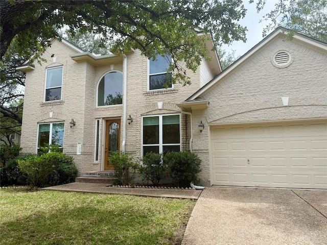 2009 Saint Andrews Dr, Round Rock, TX 78664 - traditional home featuring concrete driveway, a garage, and a front yard