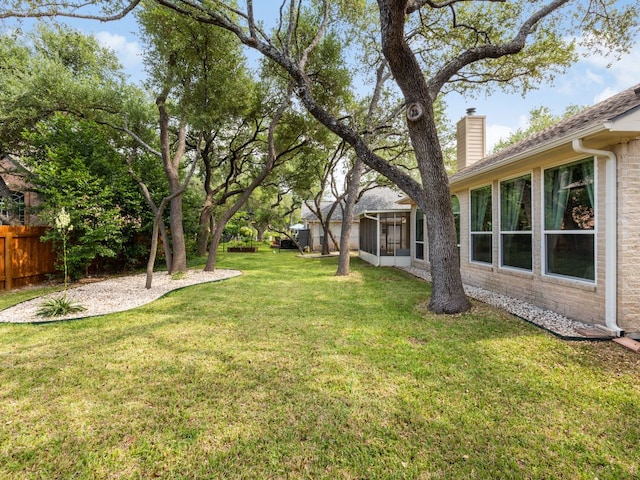 2009 Saint Andrews Dr, Round Rock, TX 78664 - view of yard featuring a sunroom