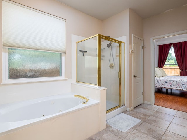 2009 Saint Andrews Dr, Round Rock, TX 78664 - ensuite bathroom with a stall shower, a tub with jets, and tile patterned floors
