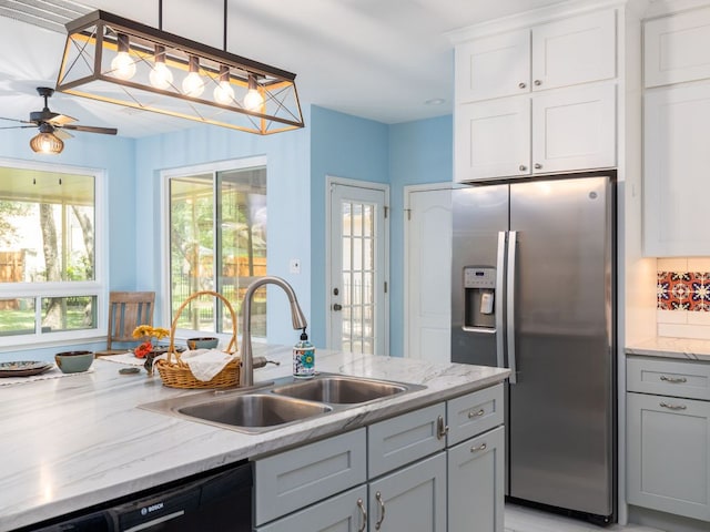 2009 Saint Andrews Dr, Round Rock, TX 78664 - kitchen with stainless steel refrigerator with ice dispenser, dishwasher, white cabinetry, a ceiling fan, and light stone countertops