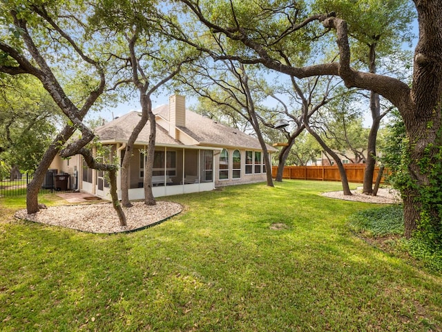 2009 Saint Andrews Dr, Round Rock, TX 78664 - view of yard with a sunroom